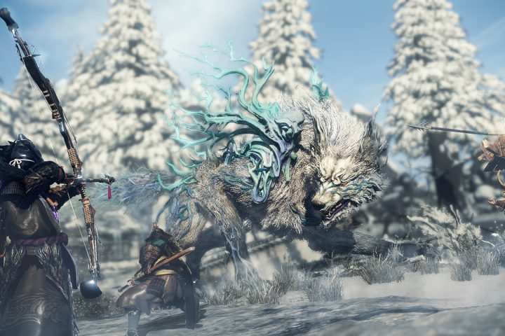 A screenshot from Wild Hearts of three warriors fighting a giant wolf.