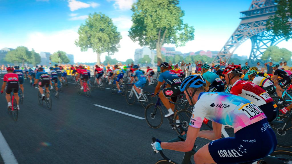 A hero shot of Tour de France 2023. The racers are riding past the Eiffel Tower in Paris.