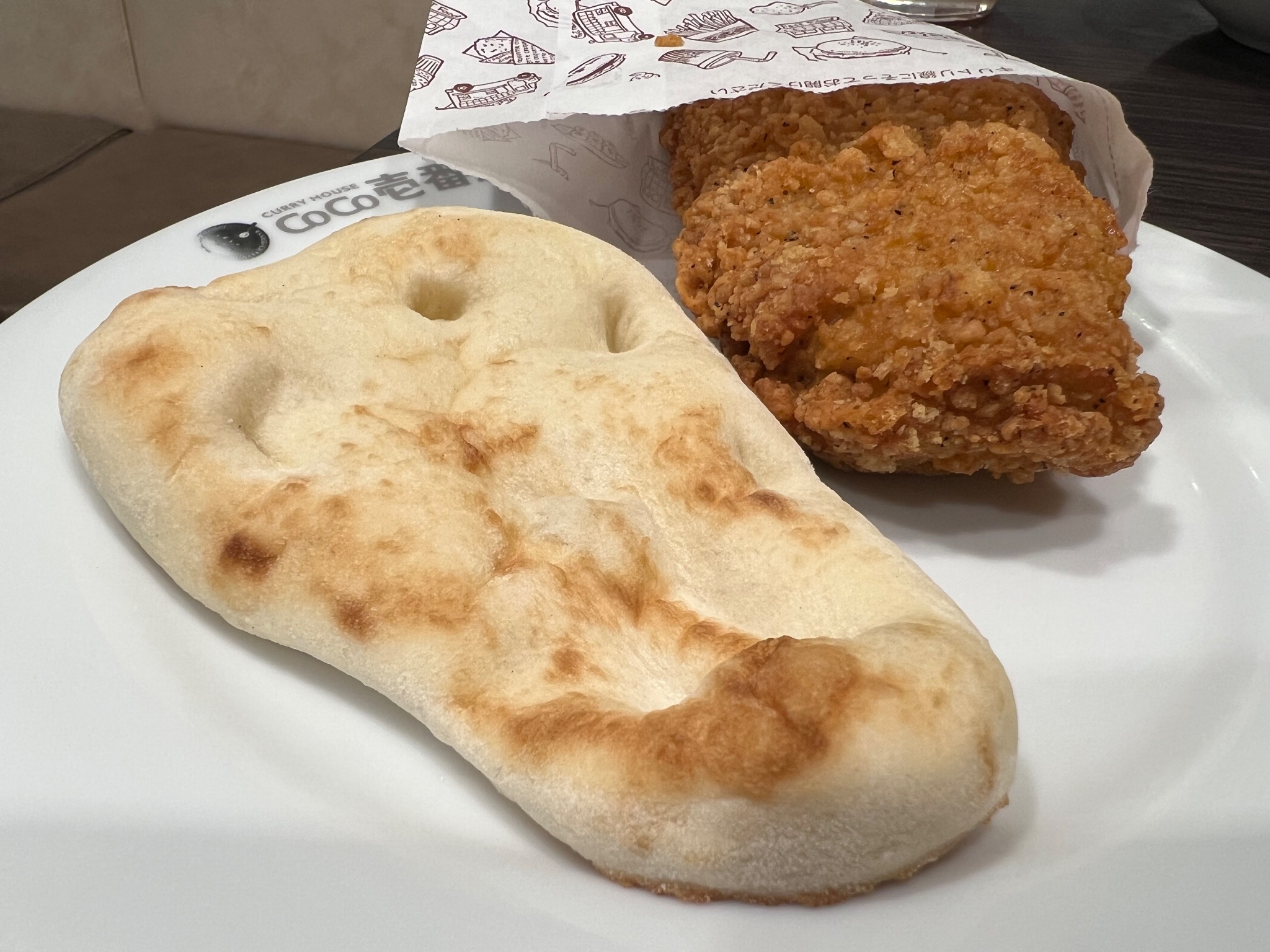 A photo of CoCo Curry naan and fried chicken